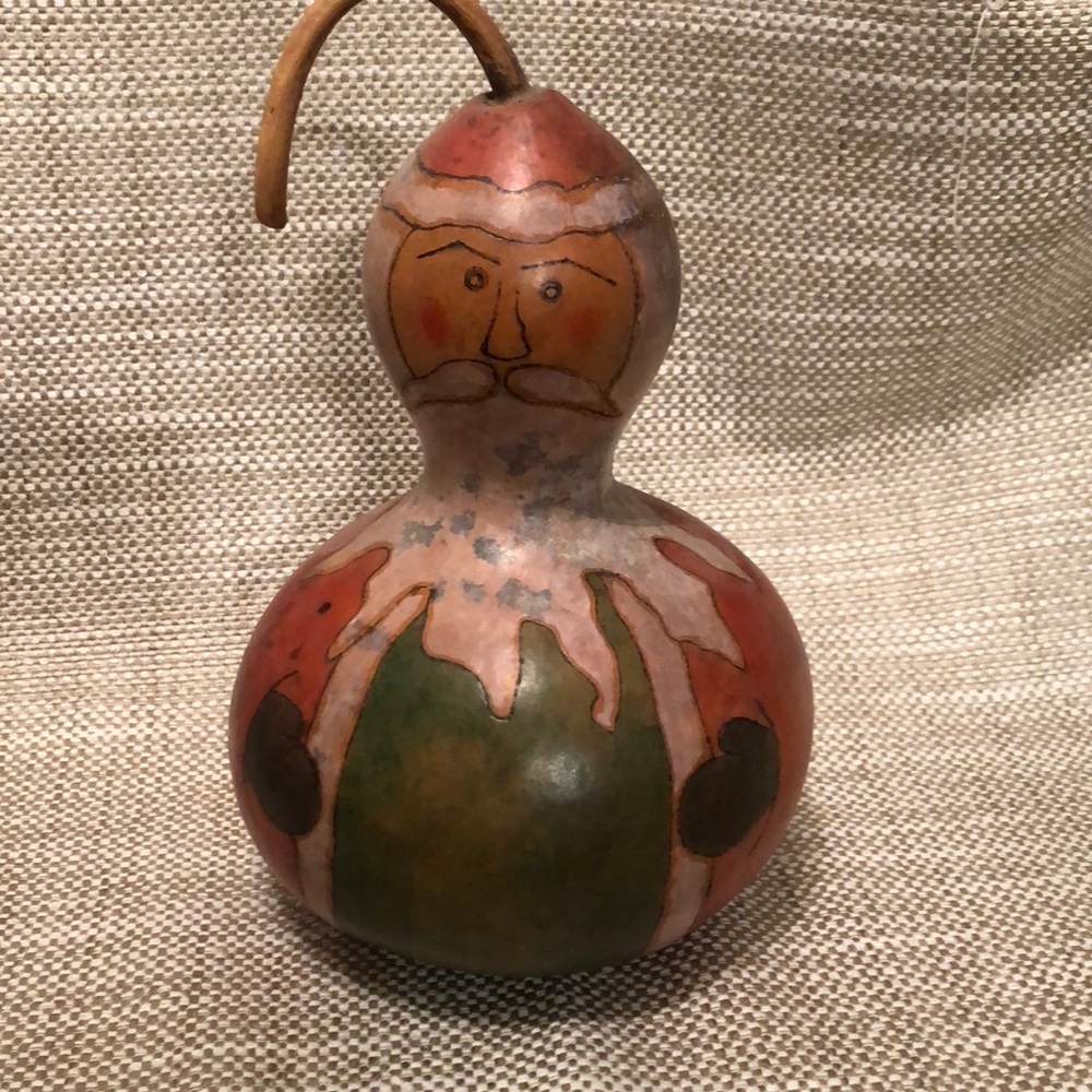Santa.  Painted on a gourd.